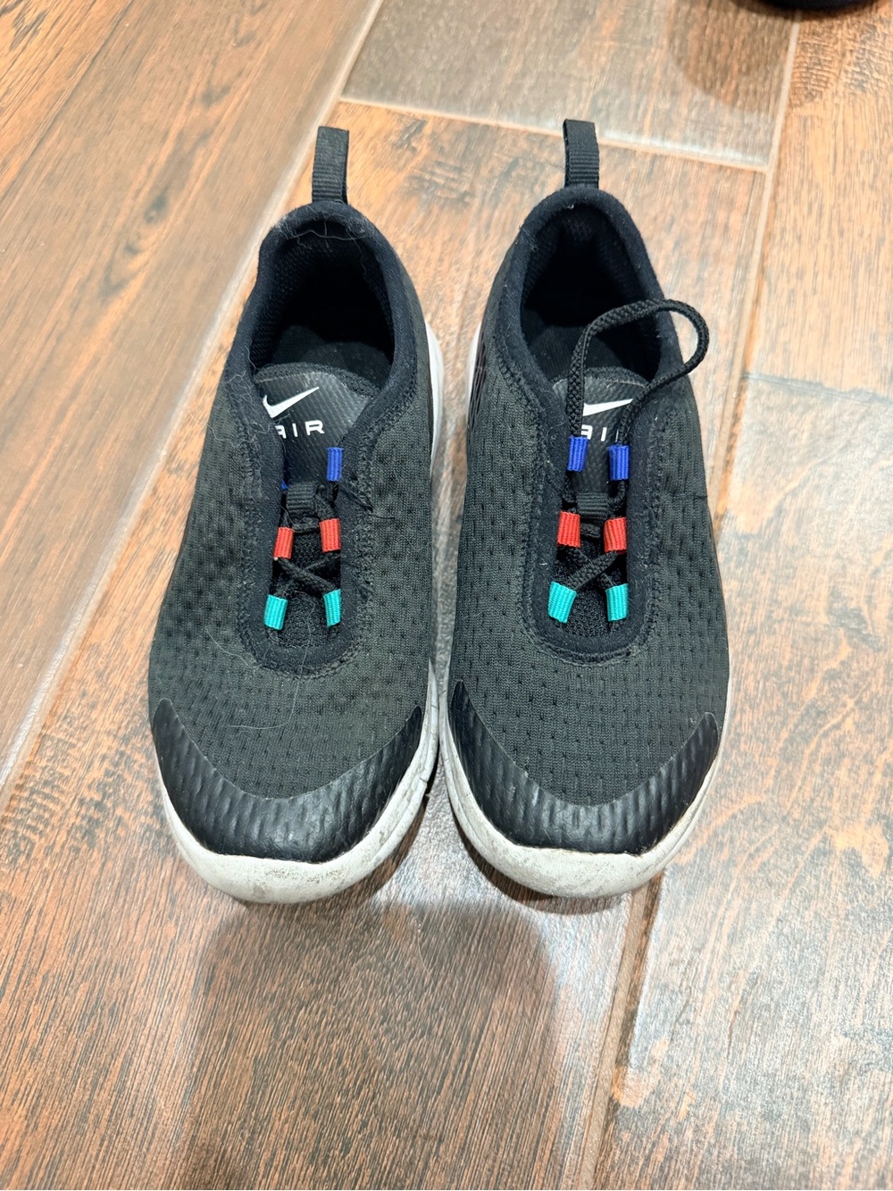 Nike Kids Black Slip-On Sneakers with Blue Red Teal Accents